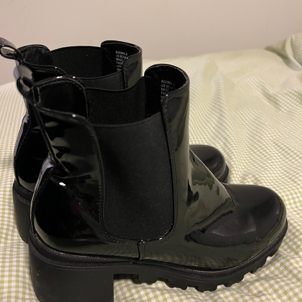 Black shiny heeled boots